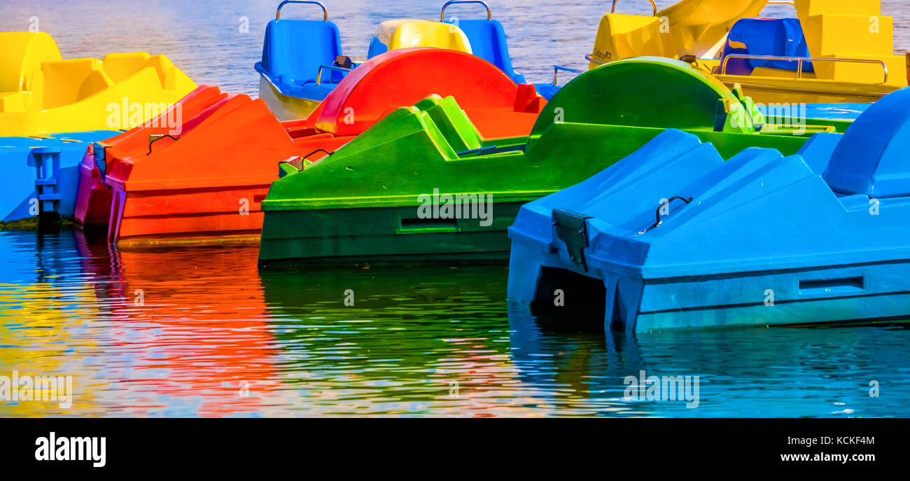Abstract shot, colored reconstruction in water, pedal boats, red, yellow, green, blue Stock Photo