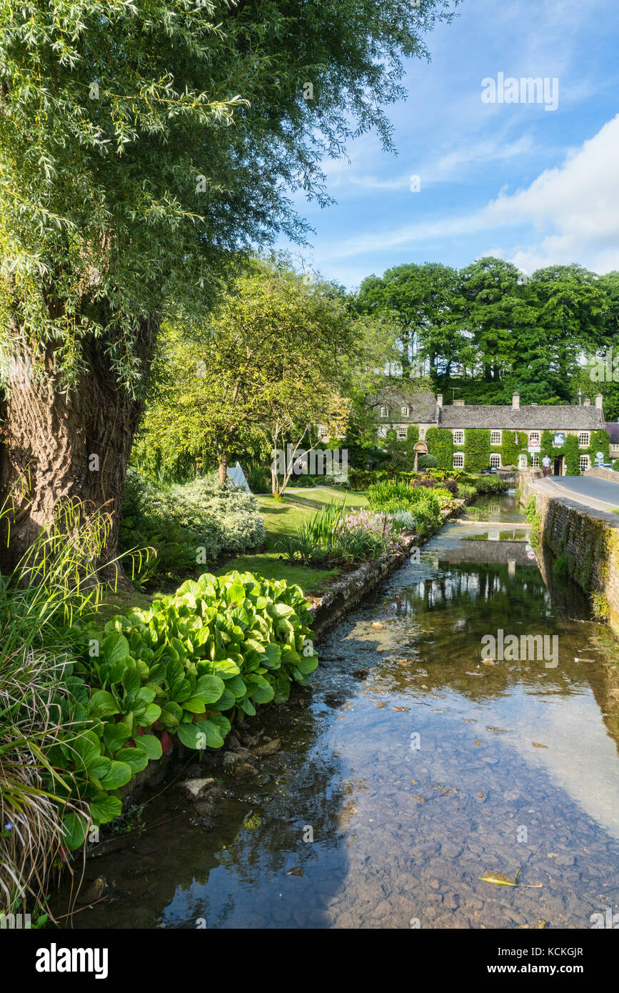 River, trout farm, and swan Hotel, Bibery, near Arlington Row, Cotswolds, England; UK Stock