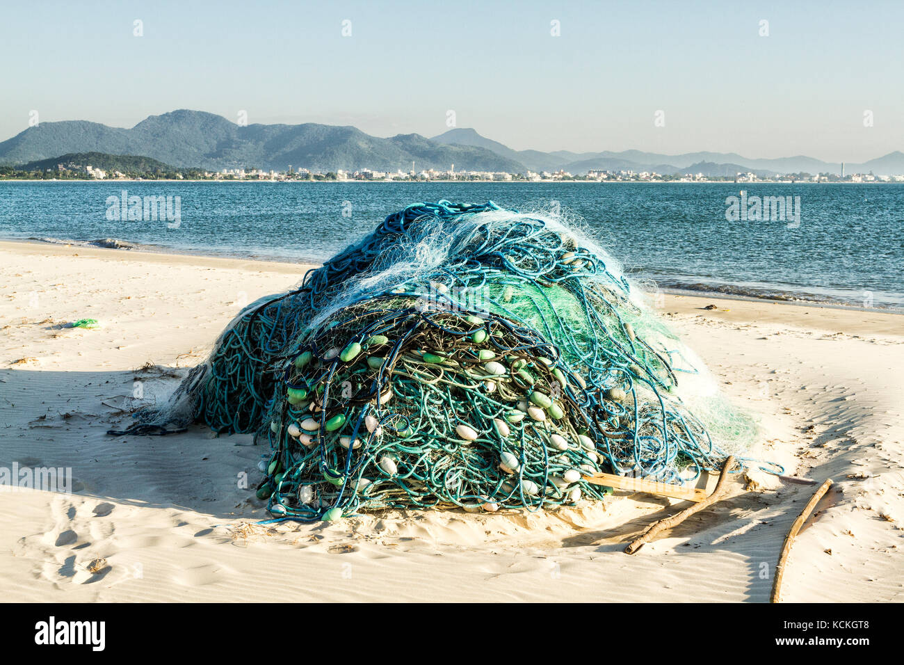 Fishing net on the sand at Ponta das Canas Beach. Florianopolis, Santa ...