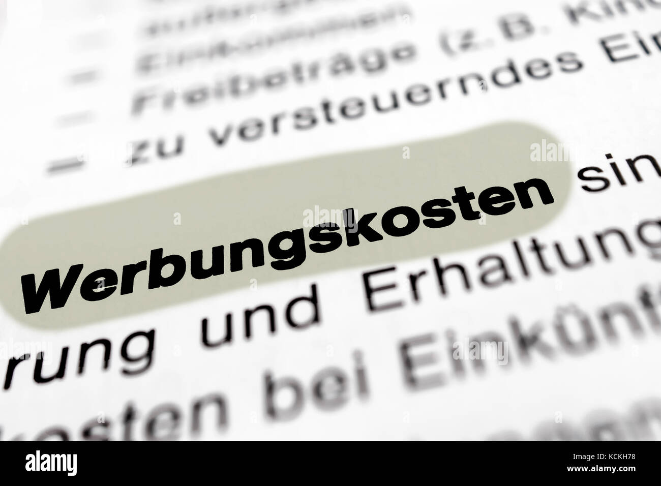 Text on page advertising costs highlight horizontal closeup Stock Photo