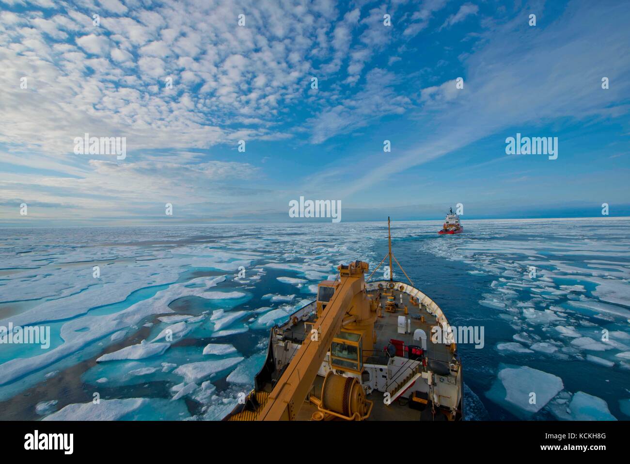 The U.S. Coast Guard Juniper-class seagoing buoy tender cutter USCGC Maple follows the Canadian Coast Guard Arctic Class 4 heavy icebreaker CCGS Terry Fox through the icy waters of the Franklin Strait during a Northwest Passage transit August 11, 2017 in Nunavut, Canada.    (photo by PO2 Nate Littlejohn via Planetpix) Stock Photo