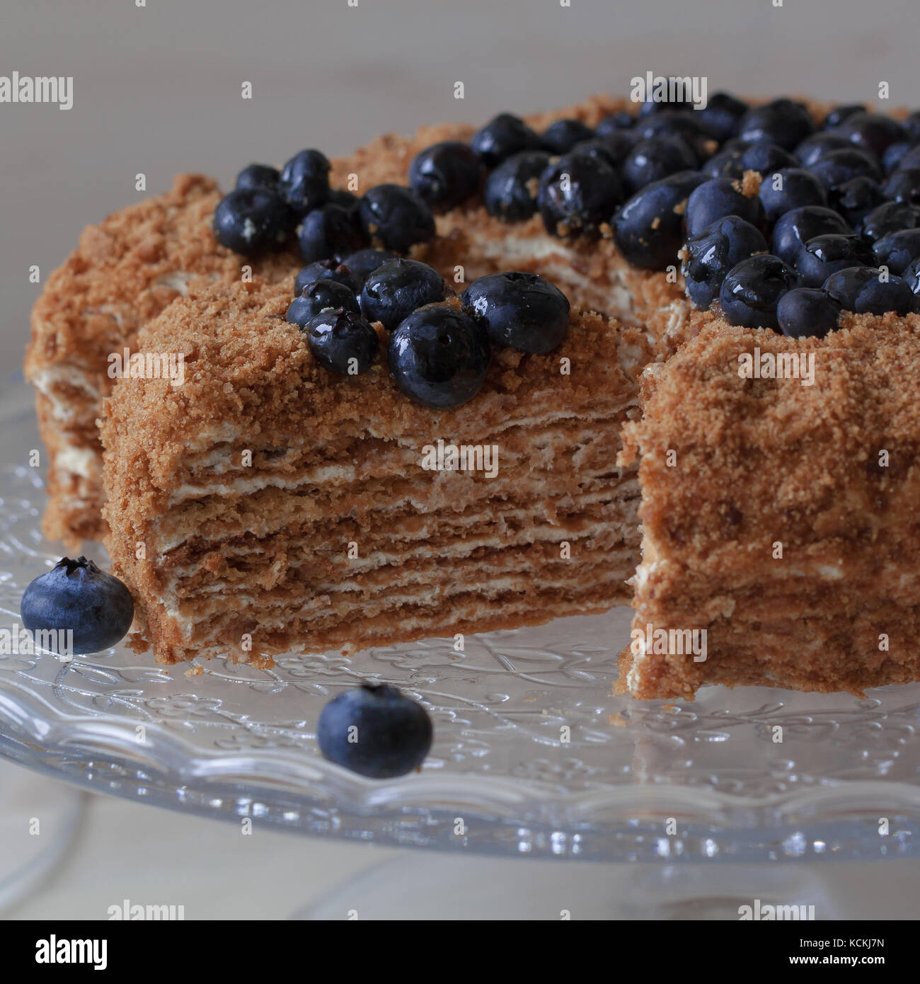 Homemade honey cake on a light wooden background Stock Photo - Alamy