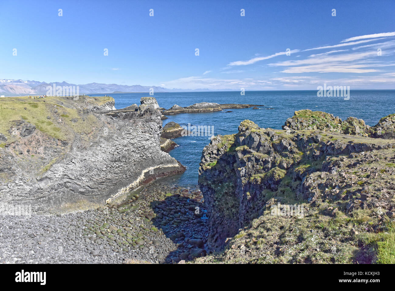Shoreline and cliffs of basalt rock at Arnarstapi nature reserve seen ...