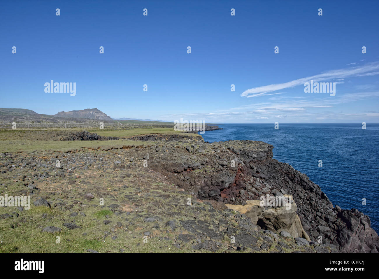 Shoreline and cliffs of basalt rock at Arnarstapi nature reserve seen ...
