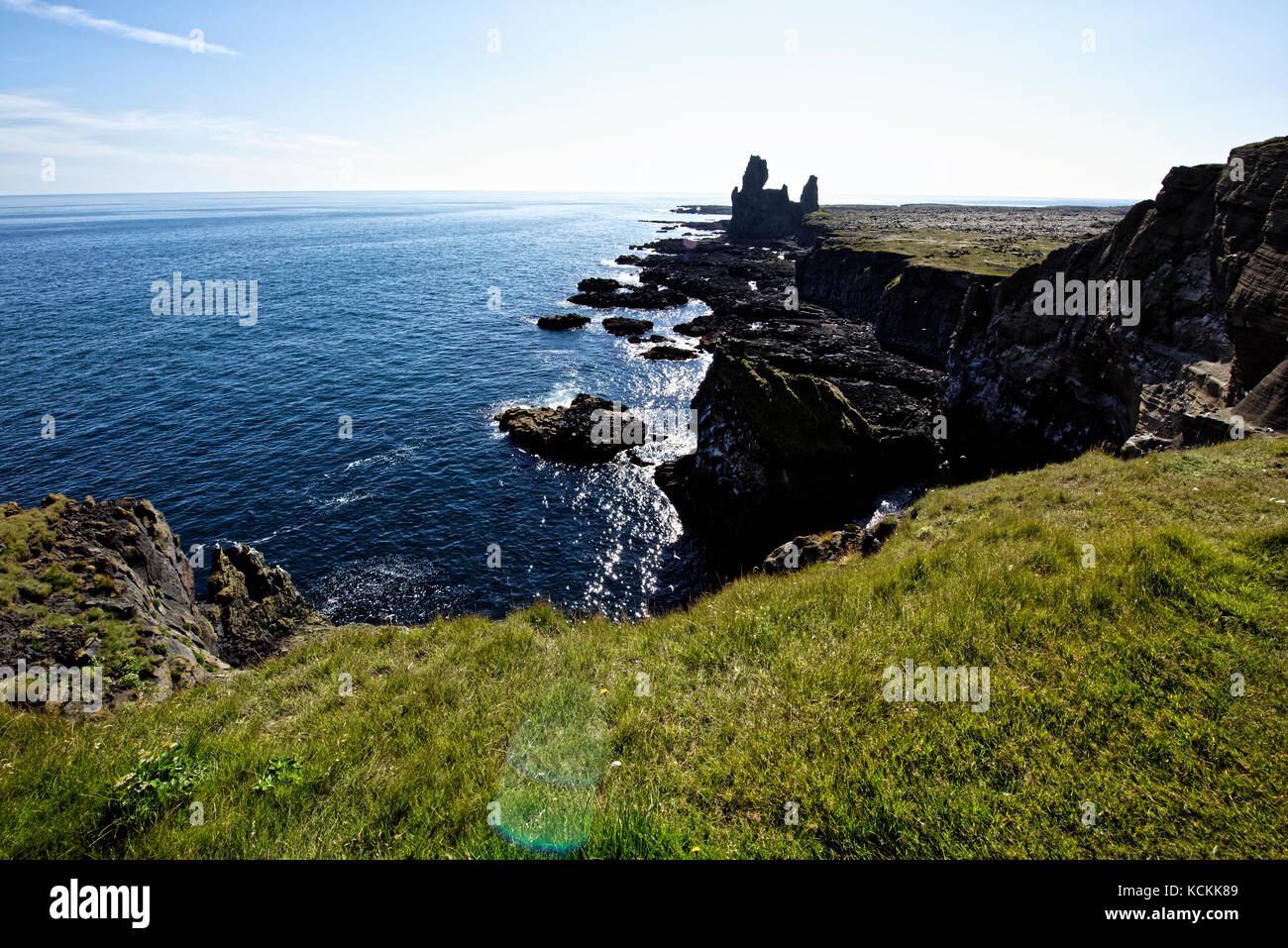 Shoreline and cliffs of basalt rock at Arnarstapi nature reserve seen ...