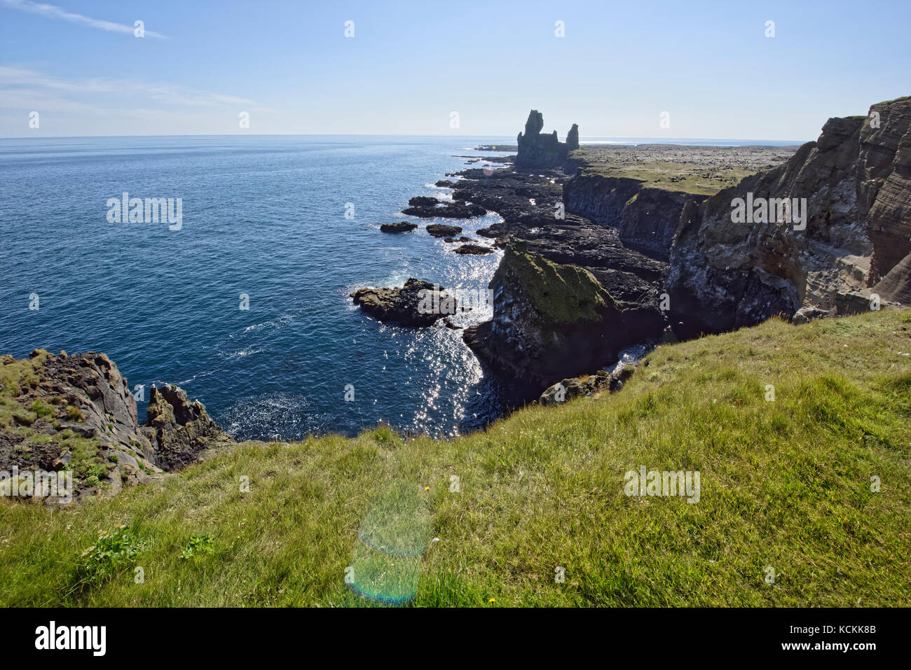 Shoreline and cliffs of basalt rock at Arnarstapi nature reserve seen