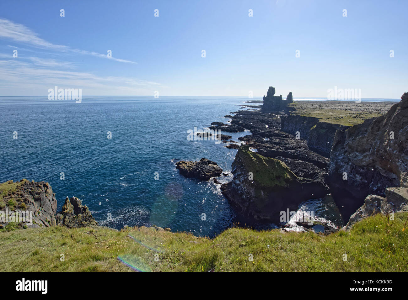 Shoreline and cliffs of basalt rock at Arnarstapi nature reserve seen ...