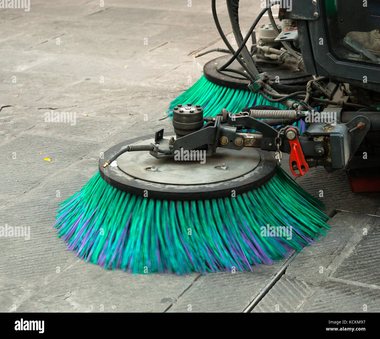 A street sweeper machine cleaning the streets. Stock Photo