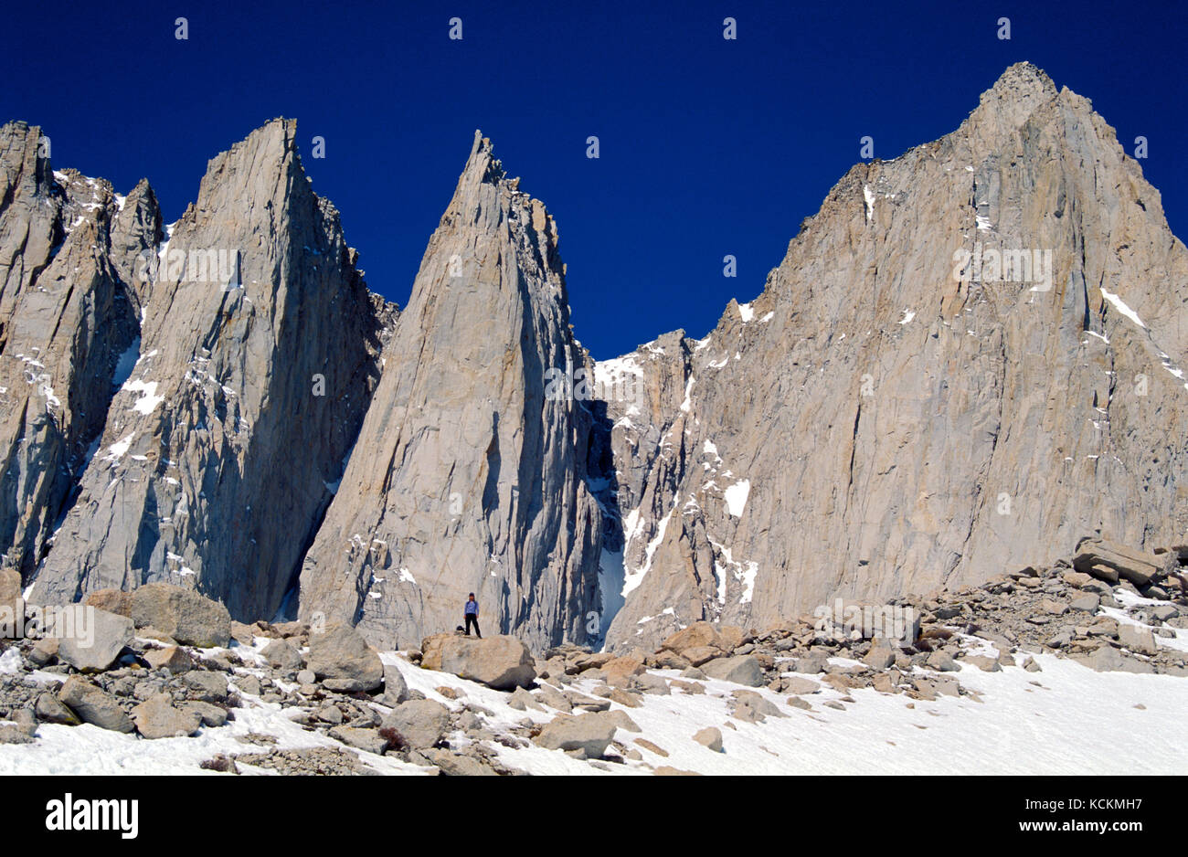 Hiker stands below Mount Whitney the highest point in the lower 48
