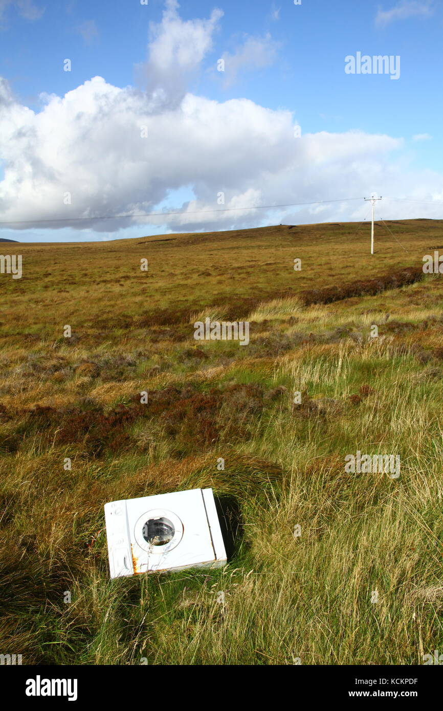 Fly-tipped washing machine on Isle of Lewis,  Scotland Stock Photo
