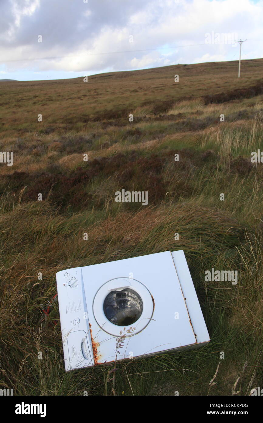 Fly-tipped washing machine near Bridge-to-Nowhere, Isle of Lewis, Scotland Stock Photo