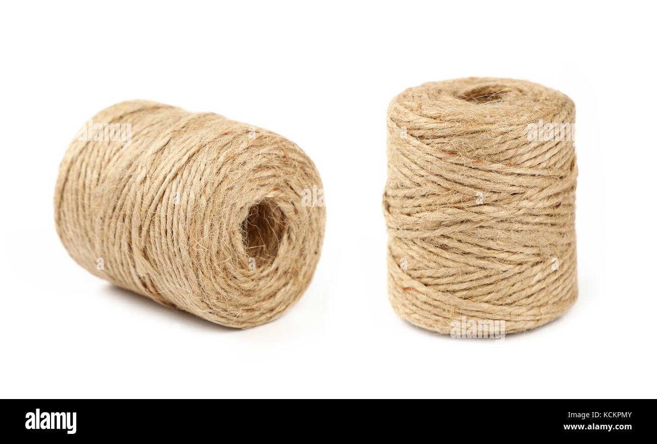 Two small coil bobbin of natural brown twine hessian burlap jute rope over  white background Stock Photo - Alamy