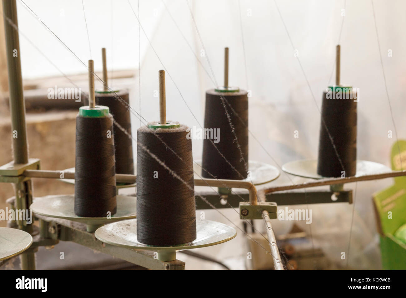 Black sewing machine thread Stock Photo Alamy