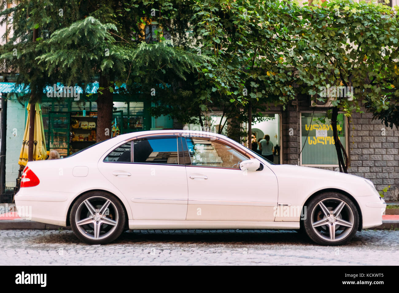 Batumi, Adjara, Georgia - September 7, 2017: Car brand Mercedes-Benz E 320 is parked on a narrow street in the old part of city Stock Photo