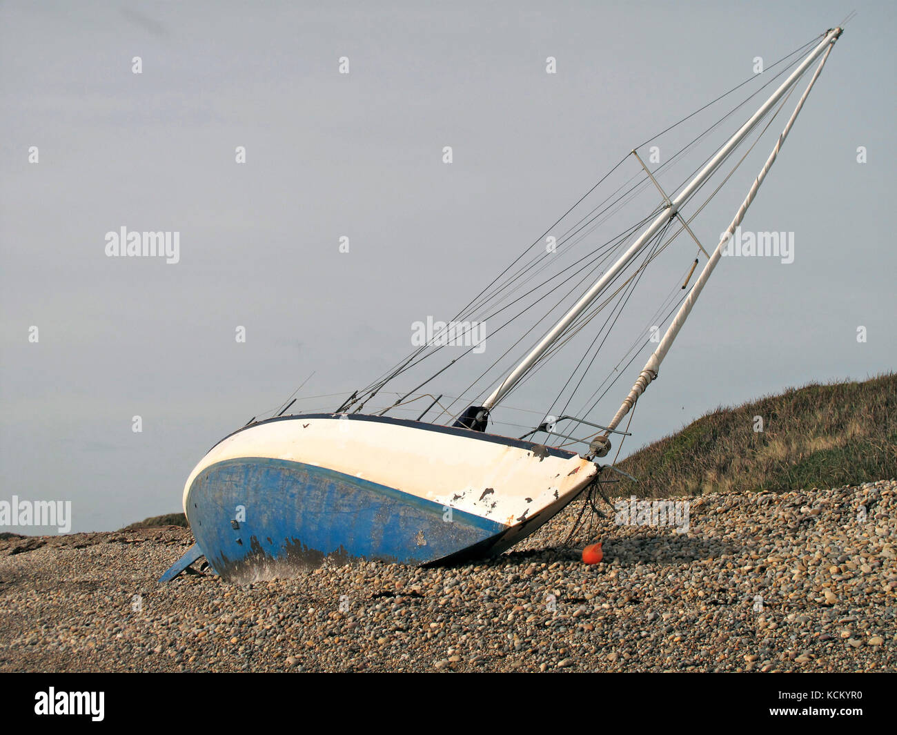 Yacht washed up on Pardoe Beach after severe flood. Devonport, Tasmania, Australia Stock Photo