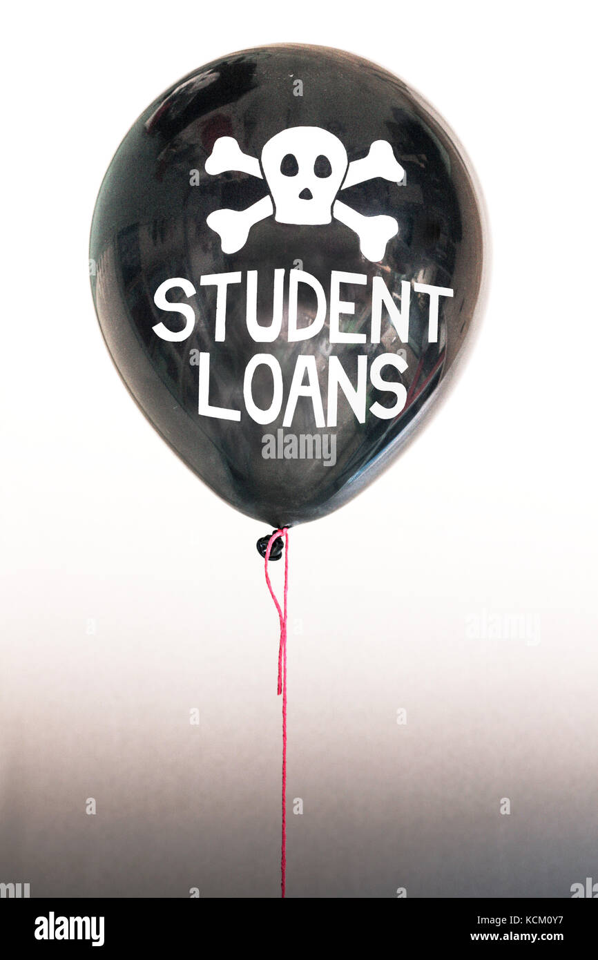 The words student loans and a skull and cross bones on a balloon illustrating the concept of a debt bubble, sovereign debt default, US, EU debt. Stock Photo