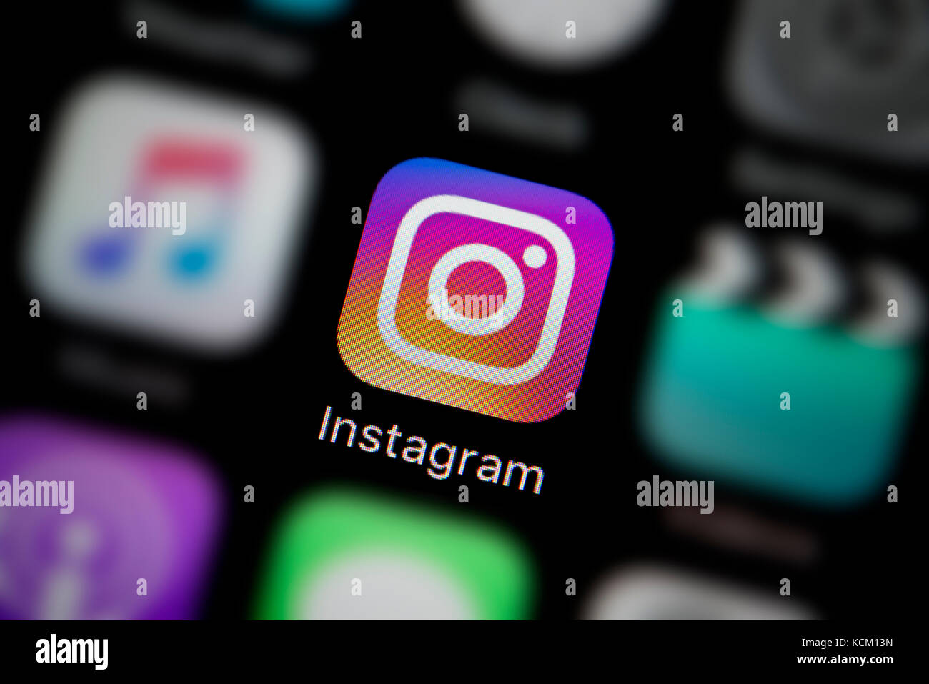 A close-up shot of the company logo representing the Instagram app icon, as seen on the screen of a smart phone (Editorial use only) Stock Photo