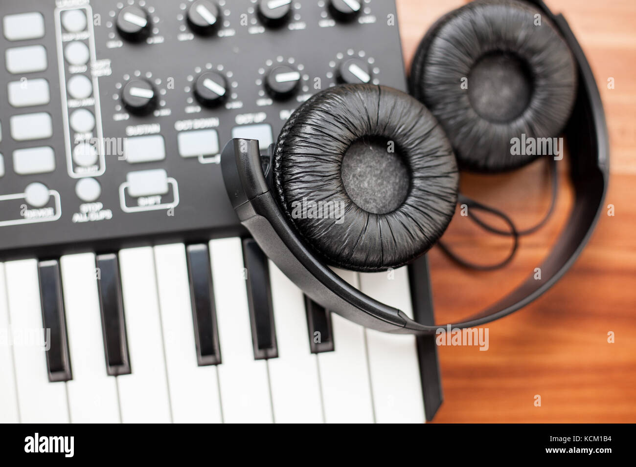 closeup photo of a mini keyboard with a pair of headphones Stock Photo
