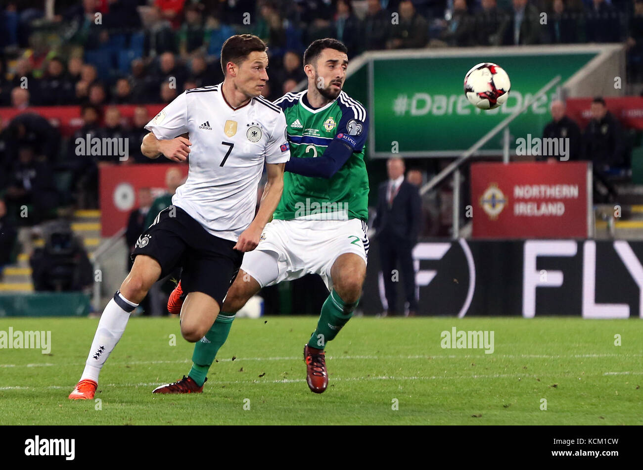 Northern Ireland's Conor McLaughlin (right) and Germany's Julian Draxler battle for the ball during the 2018 FIFA World Cup Qualifying, Group C match at Windsor Park, Belfast. Stock Photo