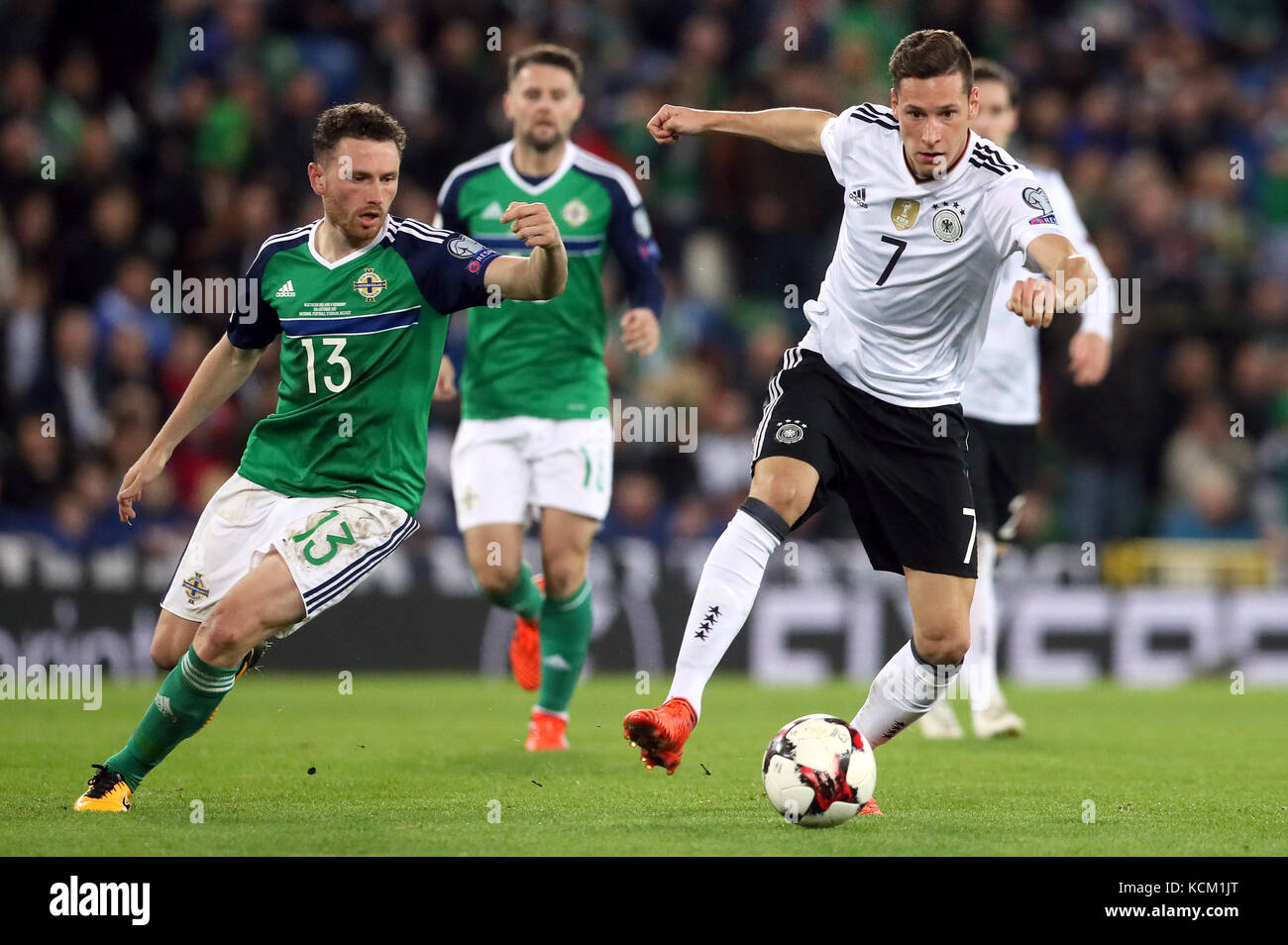 Northern Ireland's Corry Evans (left) and Germany's Julian Draxler battle for the ball during the 2018 FIFA World Cup Qualifying, Group C match at Windsor Park, Belfast. Stock Photo