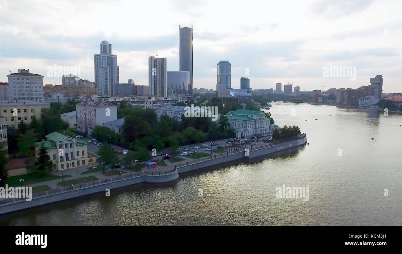 Aerial Yekaterinburg city center skyline and Iset river. Ekaterinburg is the fourth largest city in Russia and the centre of Sverdlovsk Oblast. Aerial view to the central part of Yekaterinburg, view from the sky. Stock Photo