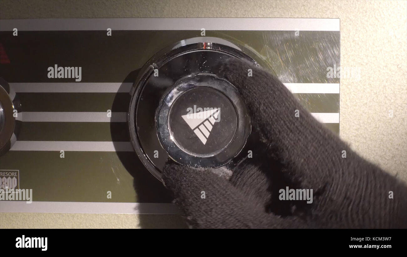Male hand adjusting gas on gas stove. A hand adjust the dial
