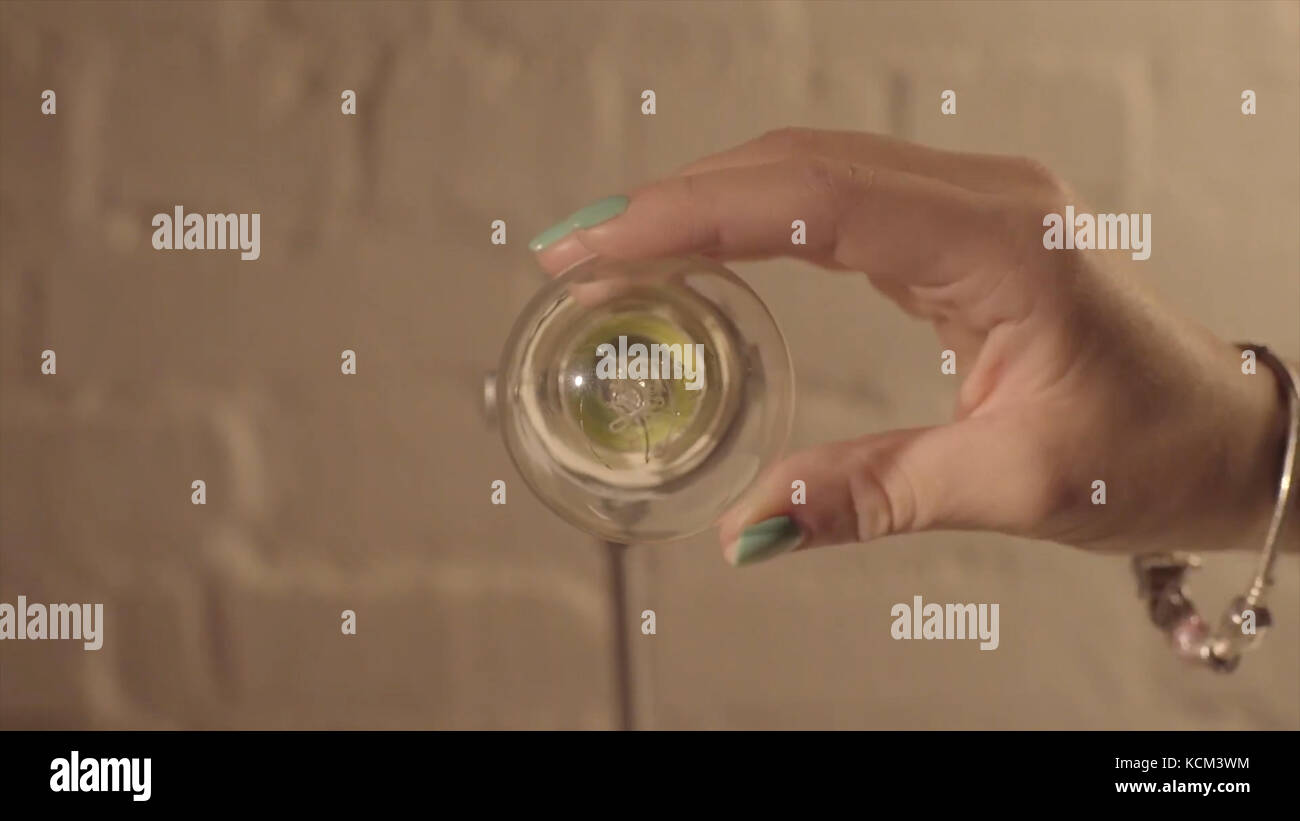 Hand turning off the bulb lamp.Turning off the light. Male hand turn on a light bulb. new idea