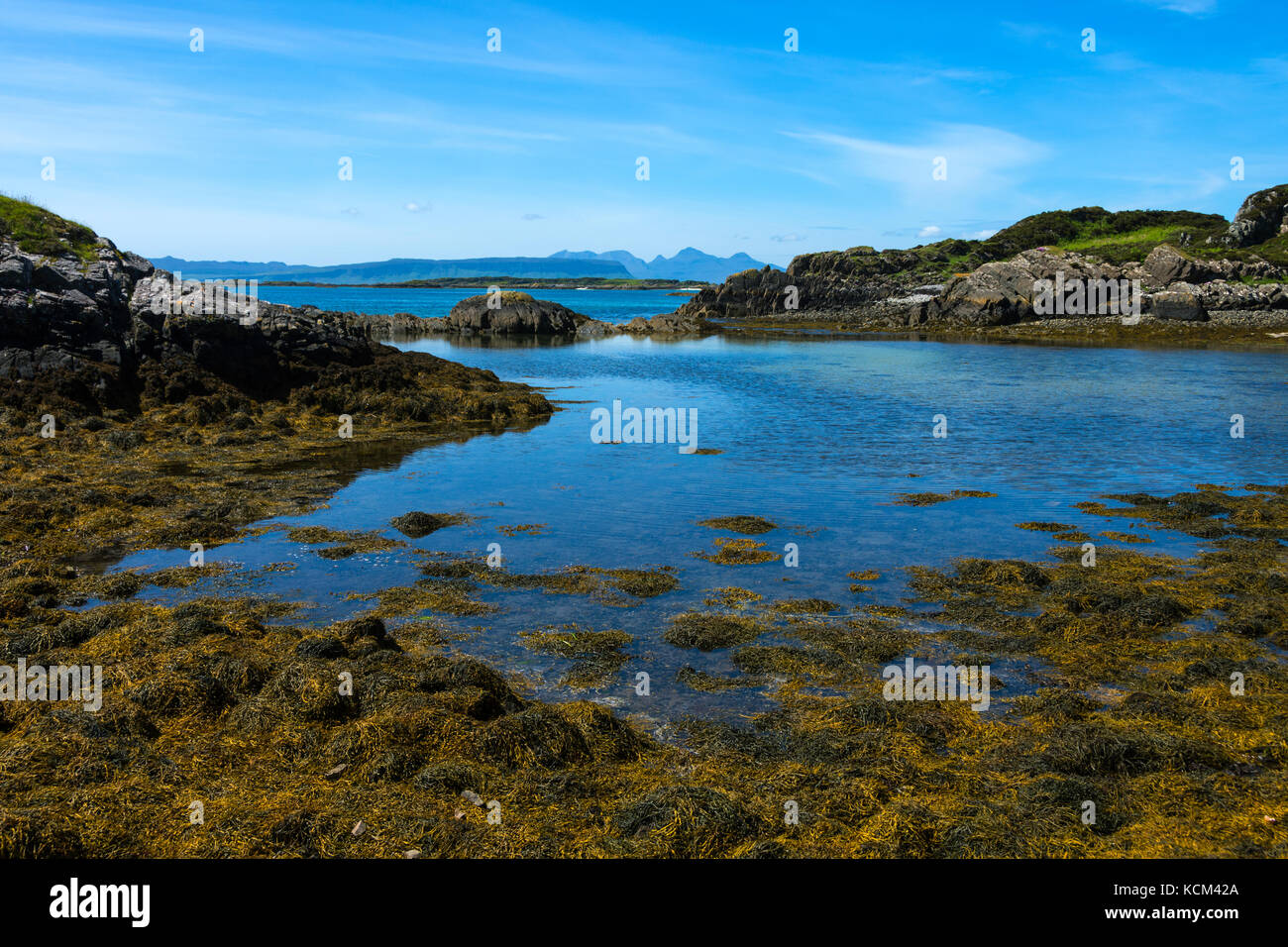The Isle of Rum from the Rhue road, near Arisaig, Scotland, UK. Stock Photo