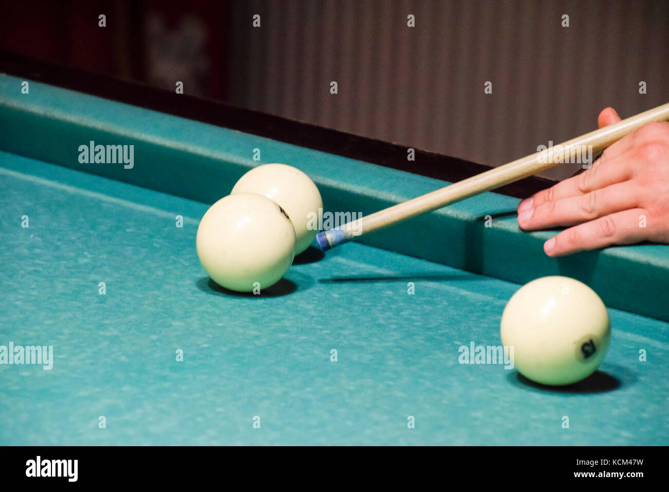 Billiards, billiard table. Targeting the cue in the ball for impact