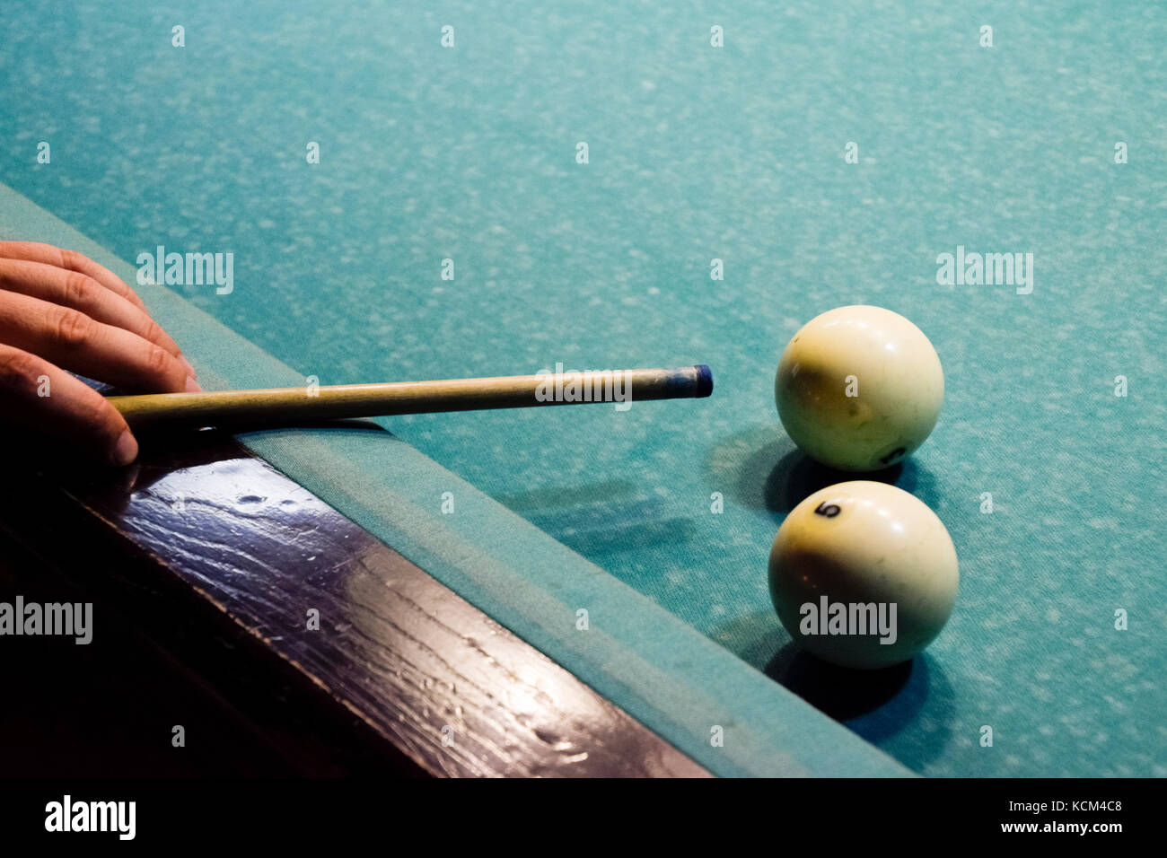 Billiards, billiard table. Targeting the cue in the ball for impact