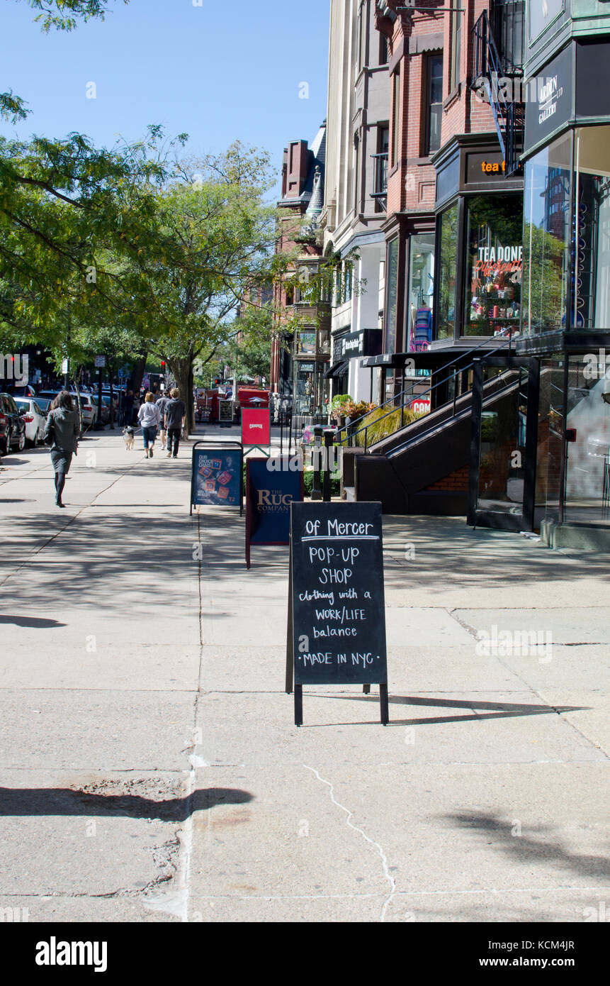 Retail store fronts and cafes along Newbury Street Back Bay in Boston