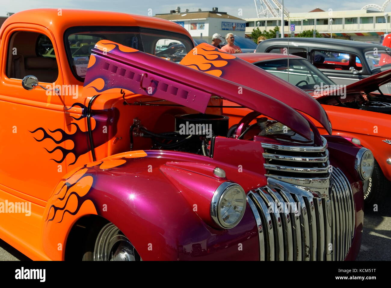 Brightly colored orange and magenta hot rod truck with flame design at the annual  Endless Summer Cruisin, Ocean City, Maryland, USA. Stock Photo