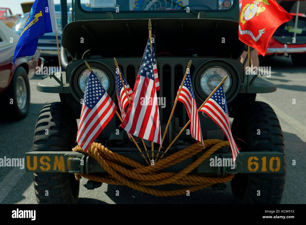 Marine Corps Jeep with five U.S. flags a Marine Corps flag, and a Delaware flag at the annual  Endless Summer Cruisin, Ocean City, Maryland, USA. Stock Photo
