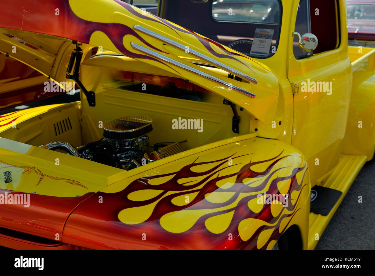 A yellow hot rod truck with red flame paint design at the annual  Endless Summer Cruisin, Ocean City, Maryland, USA. Stock Photo