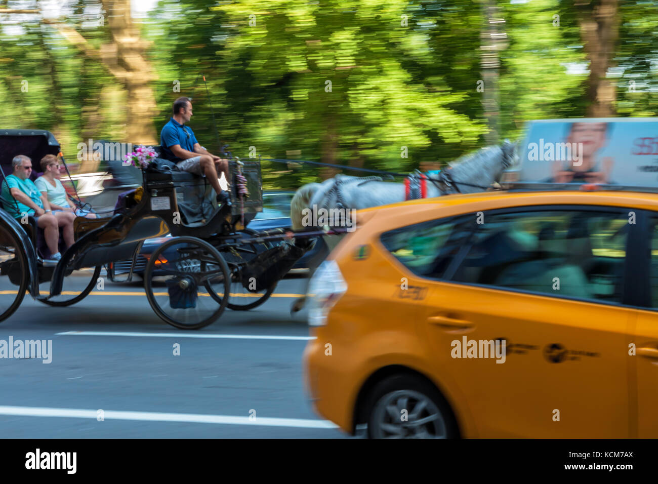 Yellow cab, horse carriage, modes of transportation in New York City, New York. Stock Photo