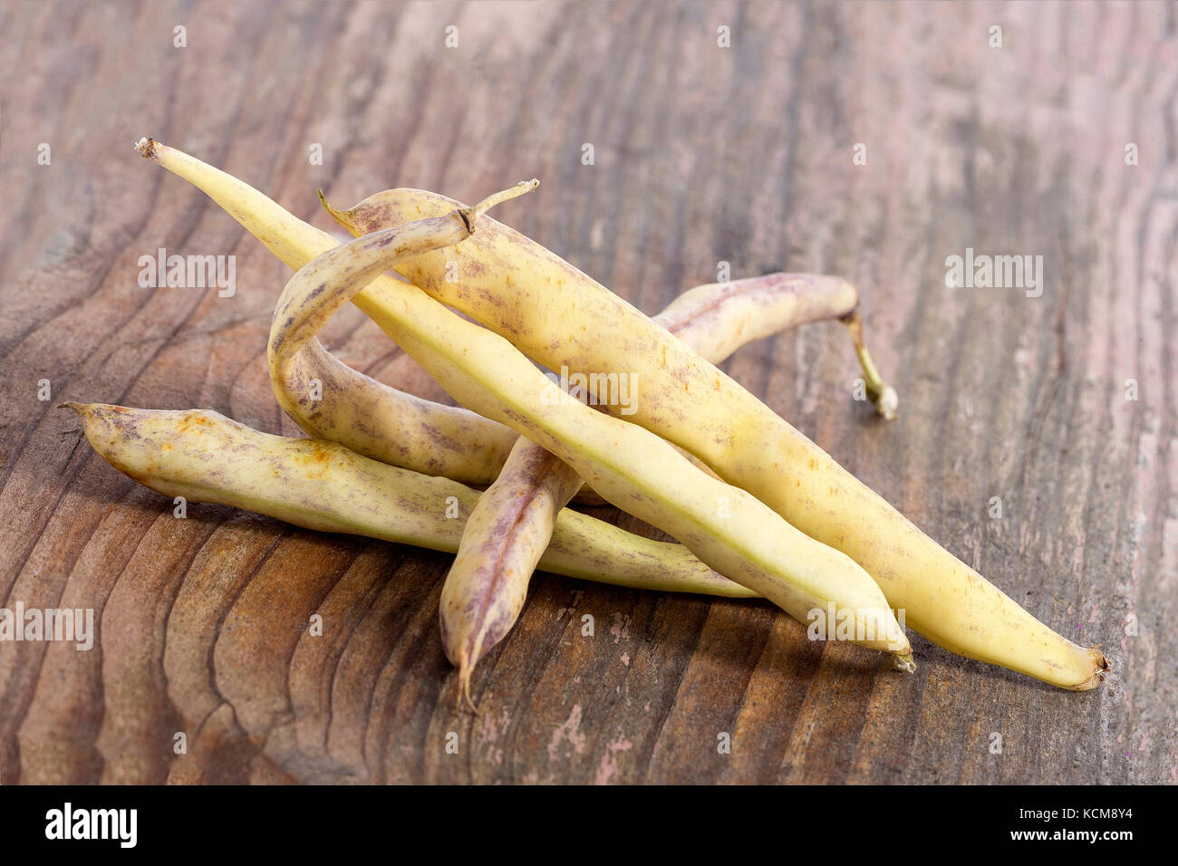 Dried pods of beans on a old vintage wooden background Stock Photo