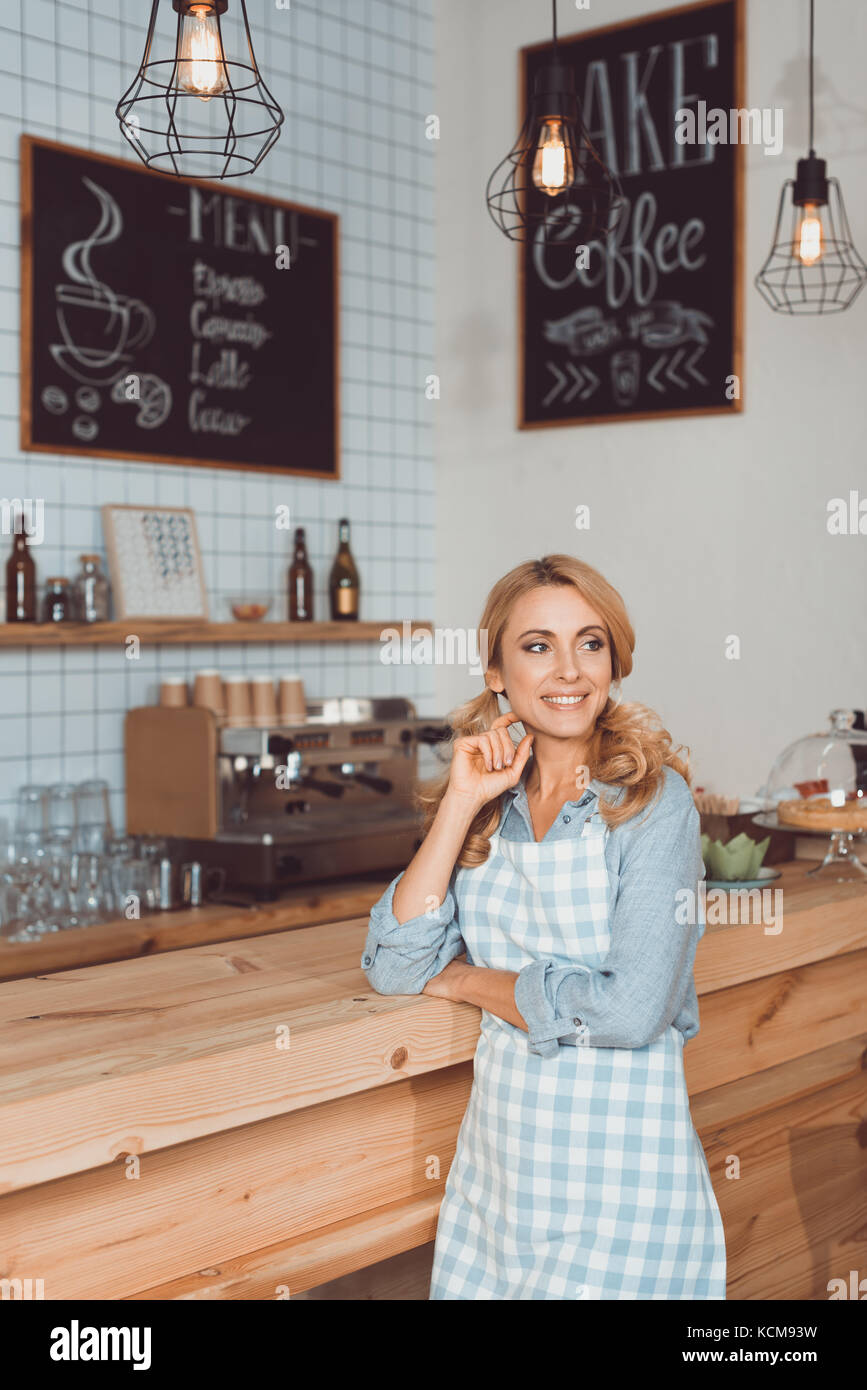 beautiful cafe owner in apron Stock Photo - Alamy