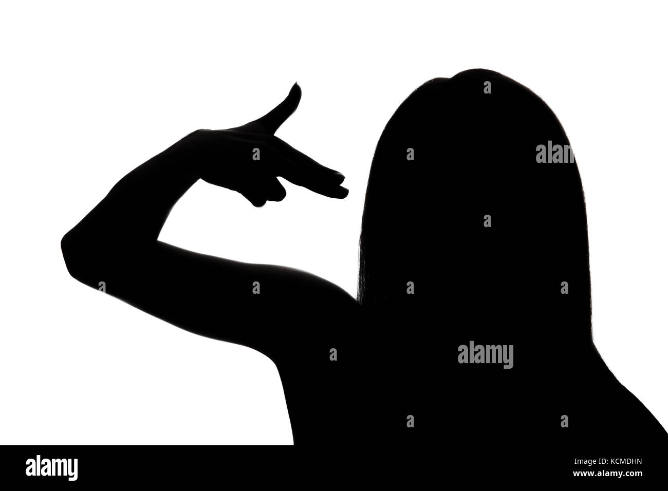 Silhouette of a woman pointing fingers to the head like shooting a gun Stock Photo