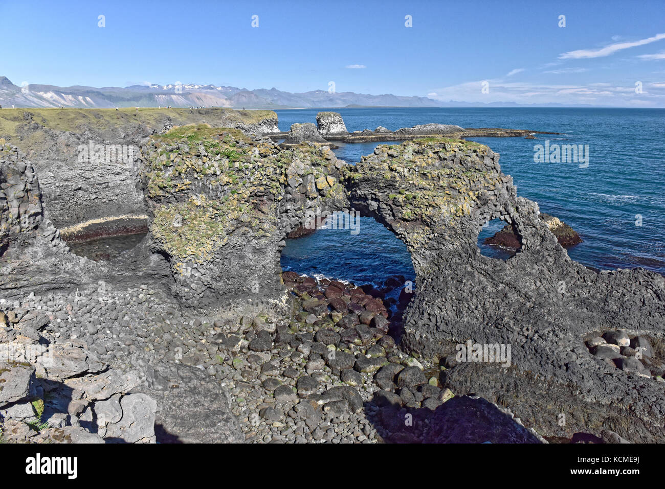 Shoreline and cliffs of basalt rock at Arnarstapi nature reserve seen ...