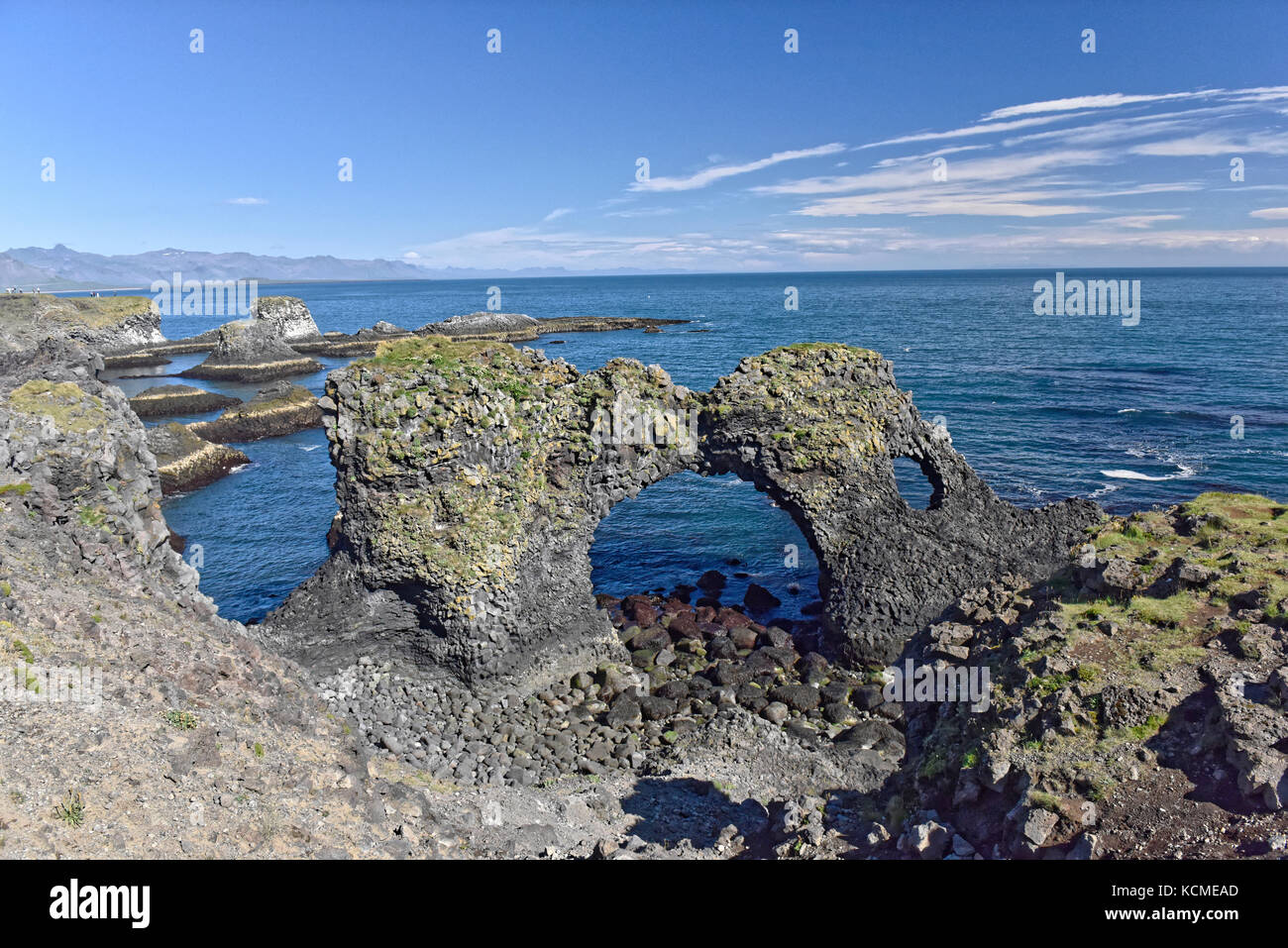 Shoreline and cliffs of basalt rock at Arnarstapi nature reserve seen ...