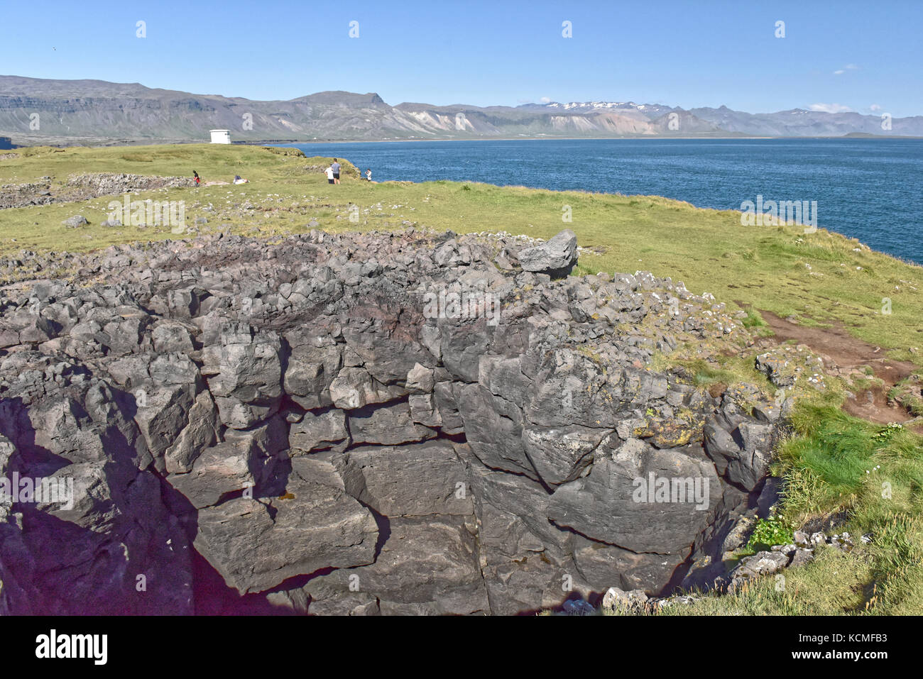 Shoreline and cliffs of basalt rock at Arnarstapi nature reserve seen ...