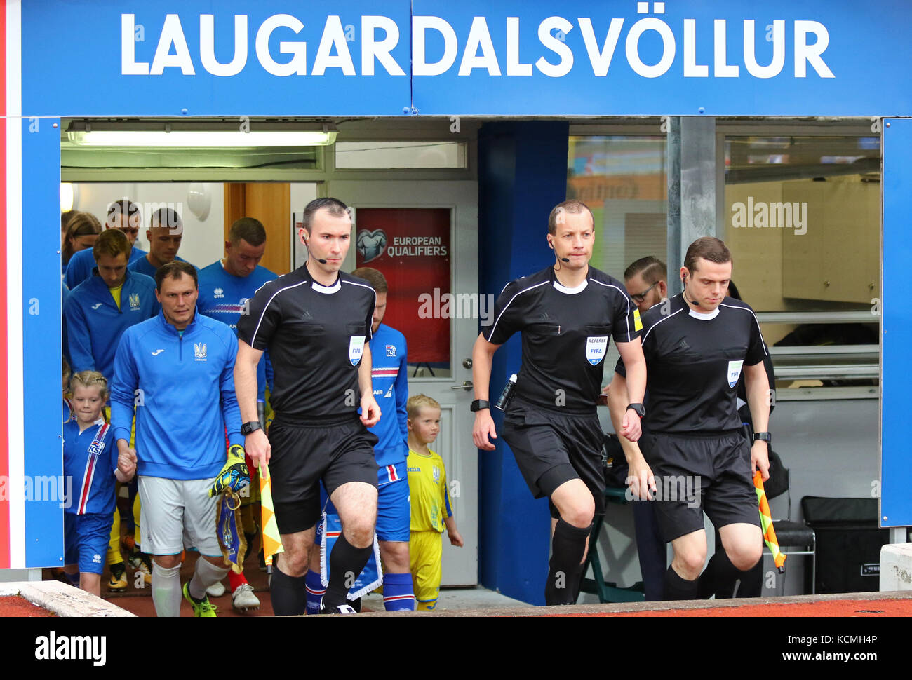 REYKJAVIK, ICELAND - SEPTEMBER 5, 2017: Referees and players go on the pitch of Laugardalsvollur stadium before FIFA World Cup 2018 qualifying game Ic Stock Photo