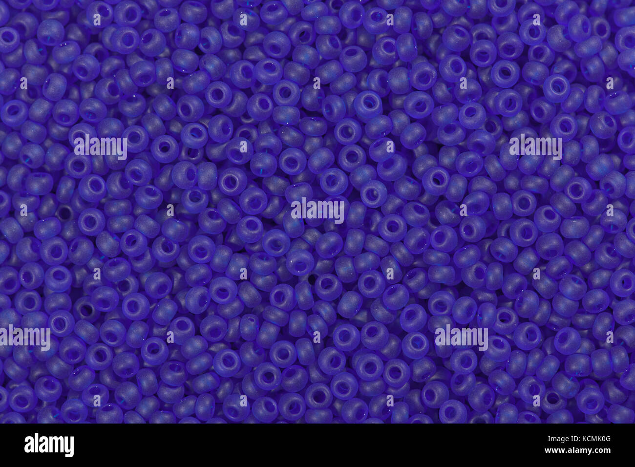 Background of beautiful purple seed beads. Stock Photo
