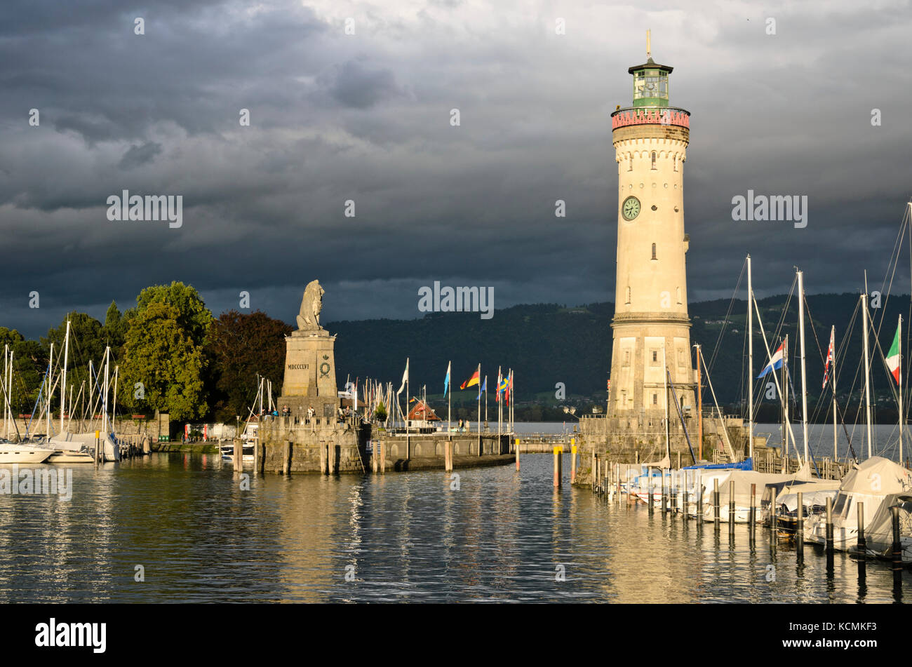 Bavarian Lion and lighthouse at the harbour, Lindau, Germany Stock Photo