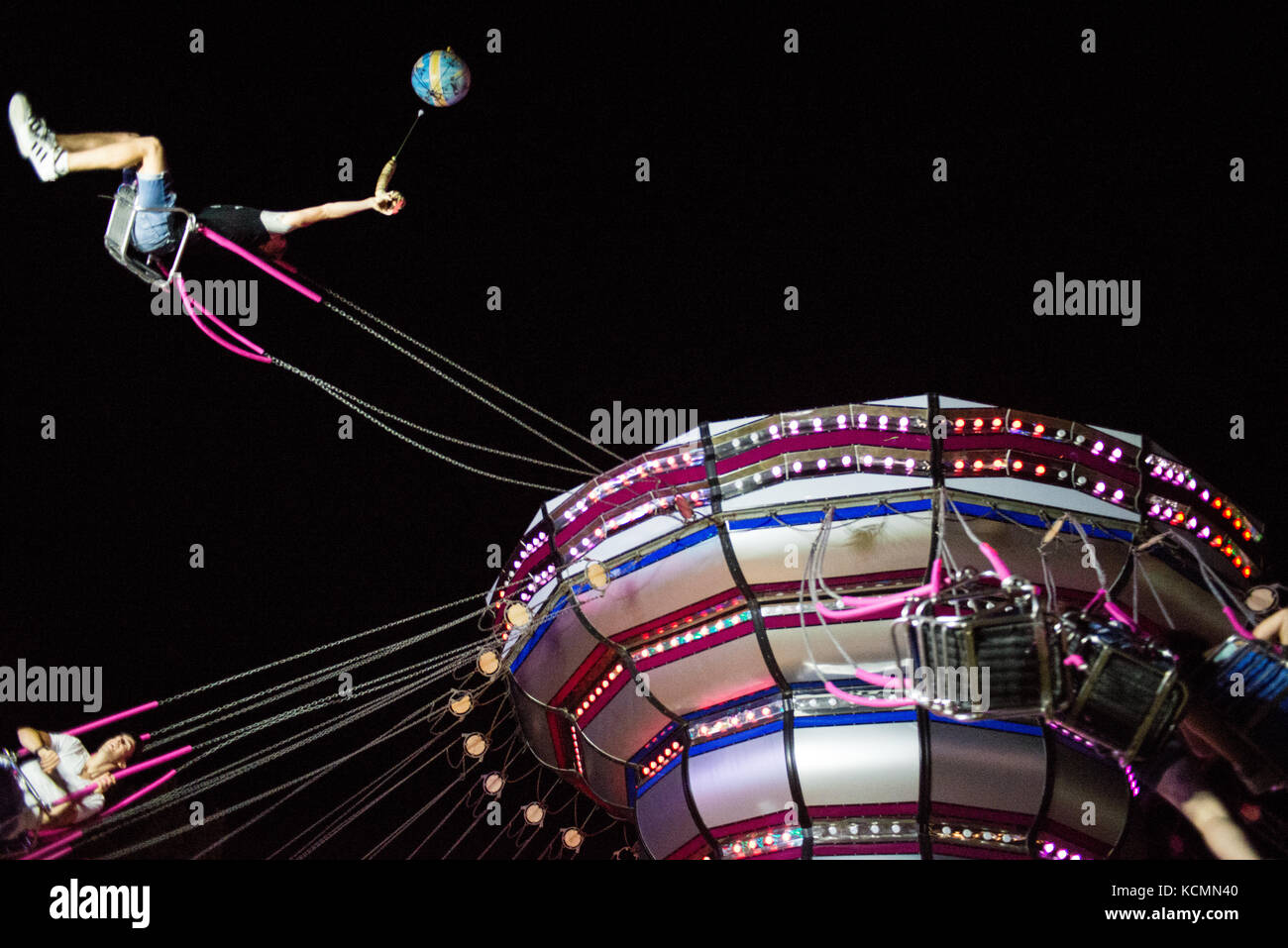 A funny ride in chairoplane with friends in an amusement Italian park