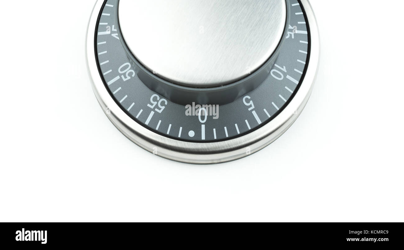Metal control knob / dial / button on a white background with text space. Potential use as a timer, thermostat or combination lock. Stock Photo