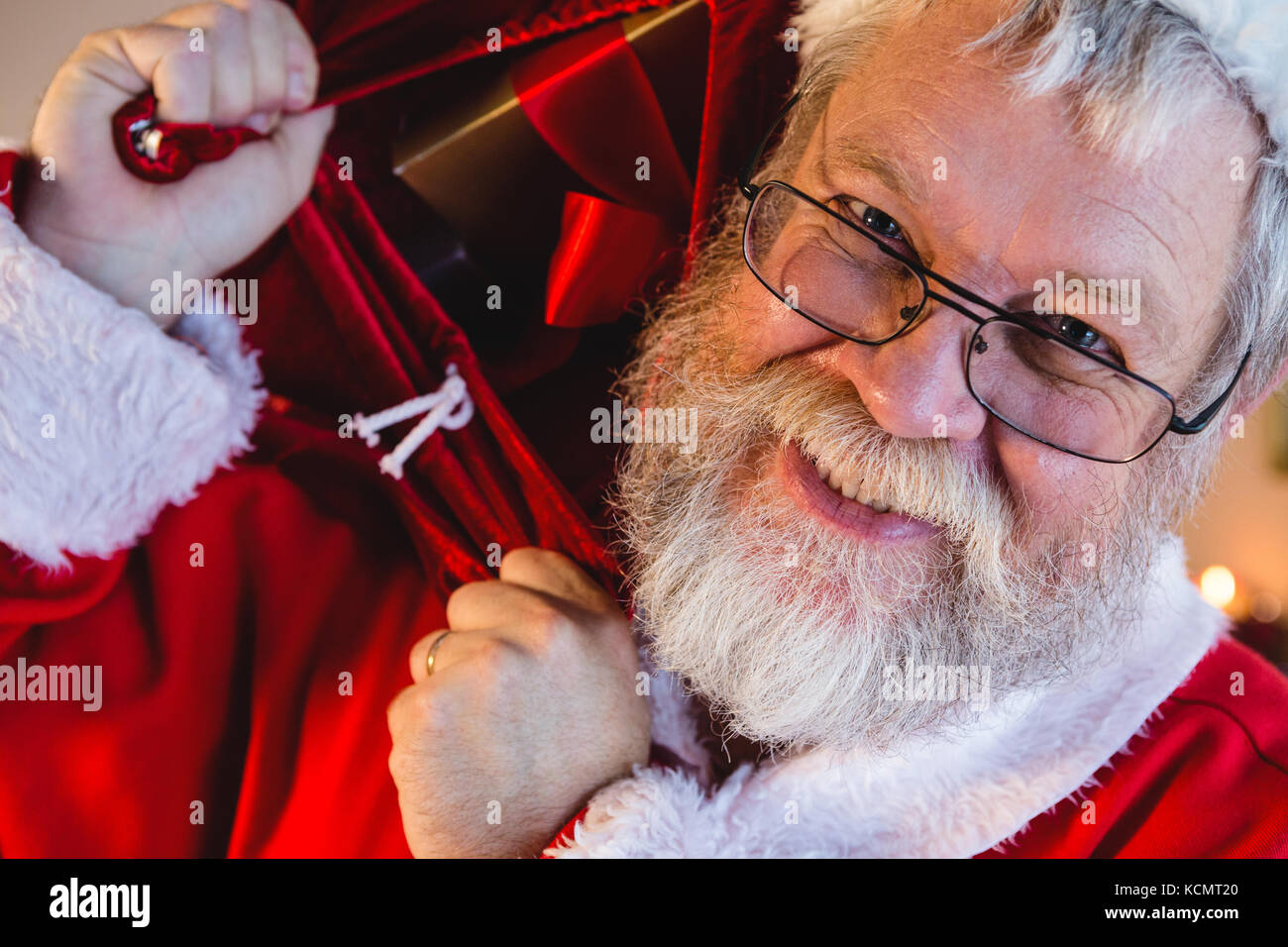 Portrait of santa claus carrying his gift sack Stock Photo - Alamy