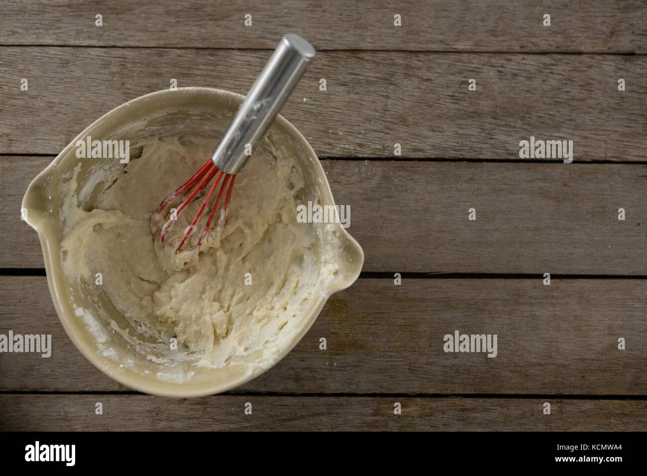 Over head view of whisk inside a semi kneaded dough Stock Photo Alamy