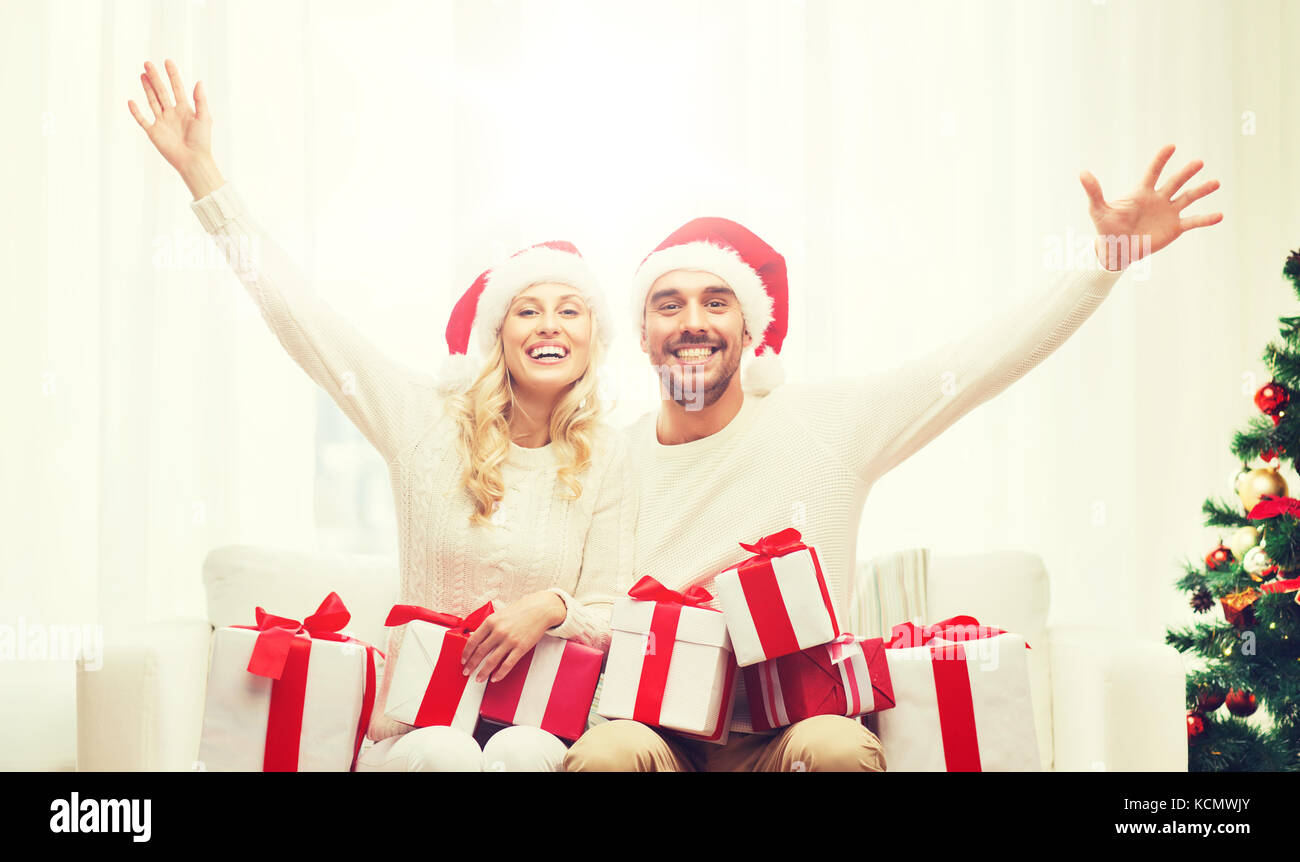 happy couple at home with christmas gift boxes Stock Photo - Alamy