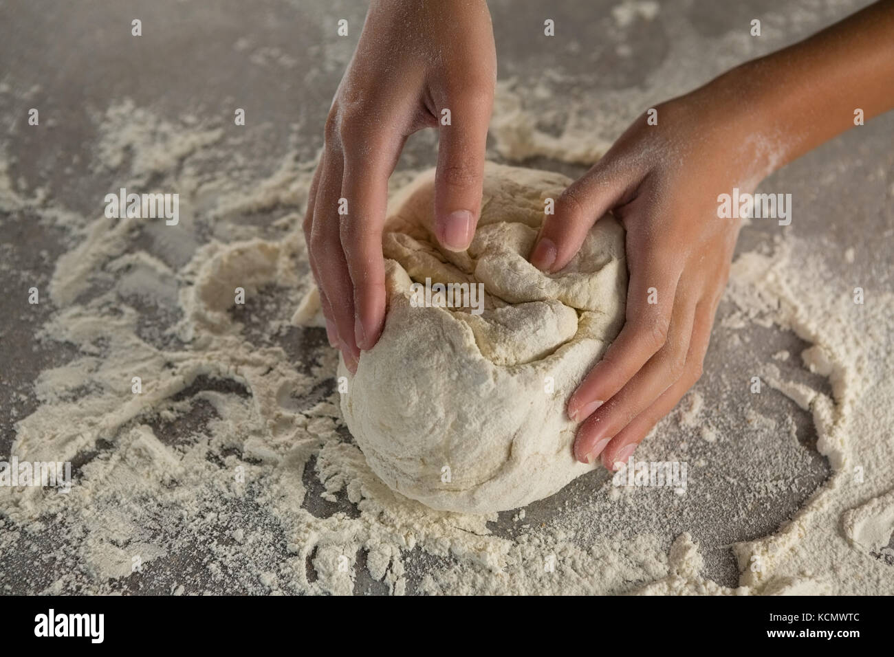 Close-up of woman kneading a dough Stock Photo - Alamy